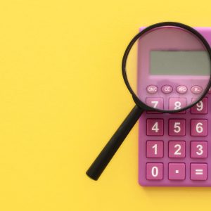 photo of a calculator and magnifying glass to signify calculating video costs