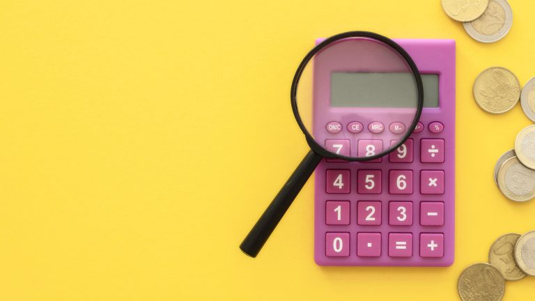 photo of a calculator and magnifying glass to signify calculating video costs