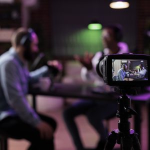 team recording a livestreaming session in front of a camera