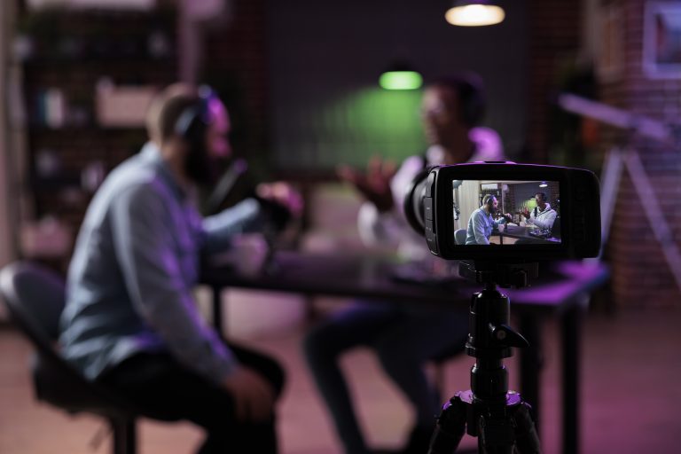 team recording a livestreaming session in front of a camera