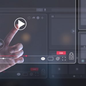 photo of finger pressing play button on a high tech video heads up display